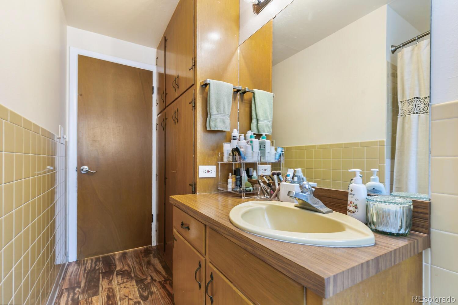 3820 Xavier Street Denver, CO 80212 - Photo 25 of 35 a bathroom with a sink and a mirror