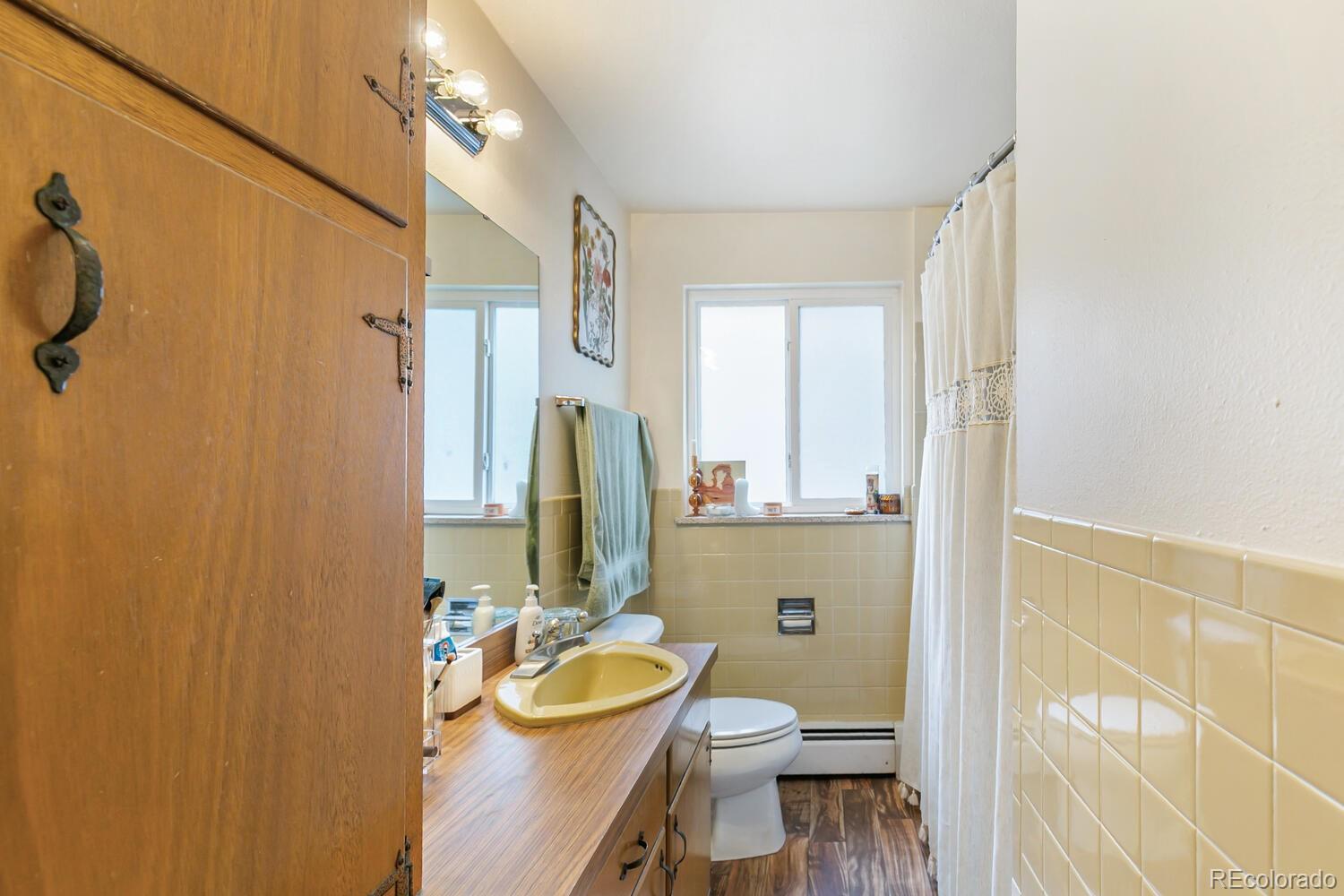 3820 Xavier Street Denver, CO 80212 - Photo 26 of 35 a bathroom with a sink a toilet and shower