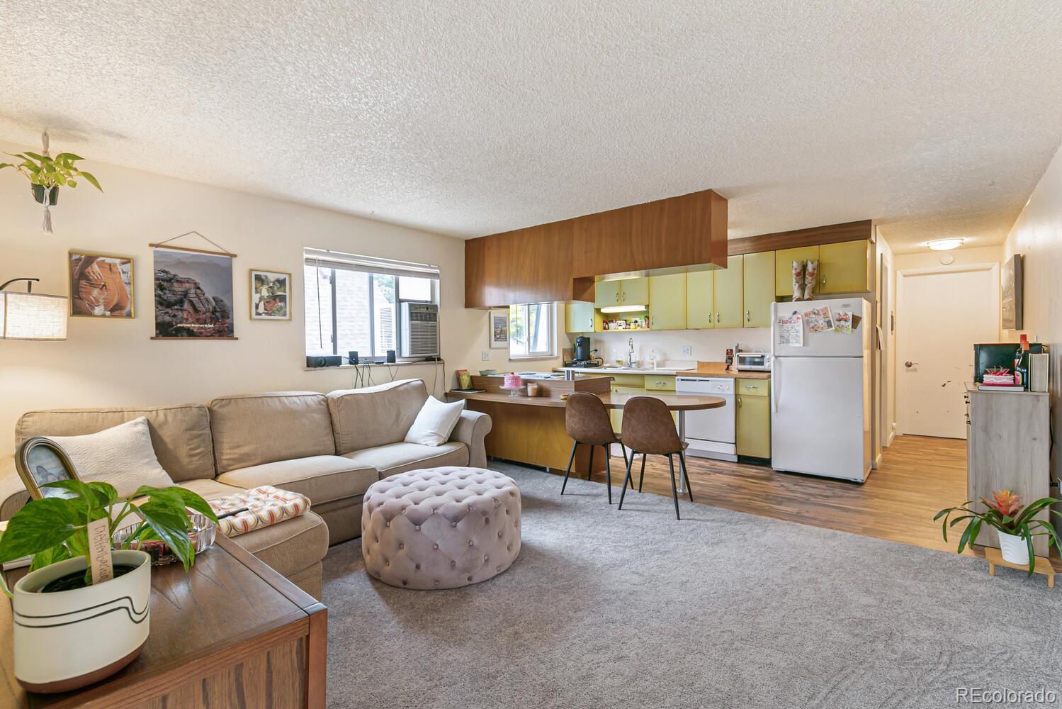 3820 Xavier Street Denver, CO 80212 - Photo 35 of 35 a living room with furniture and a kitchen area