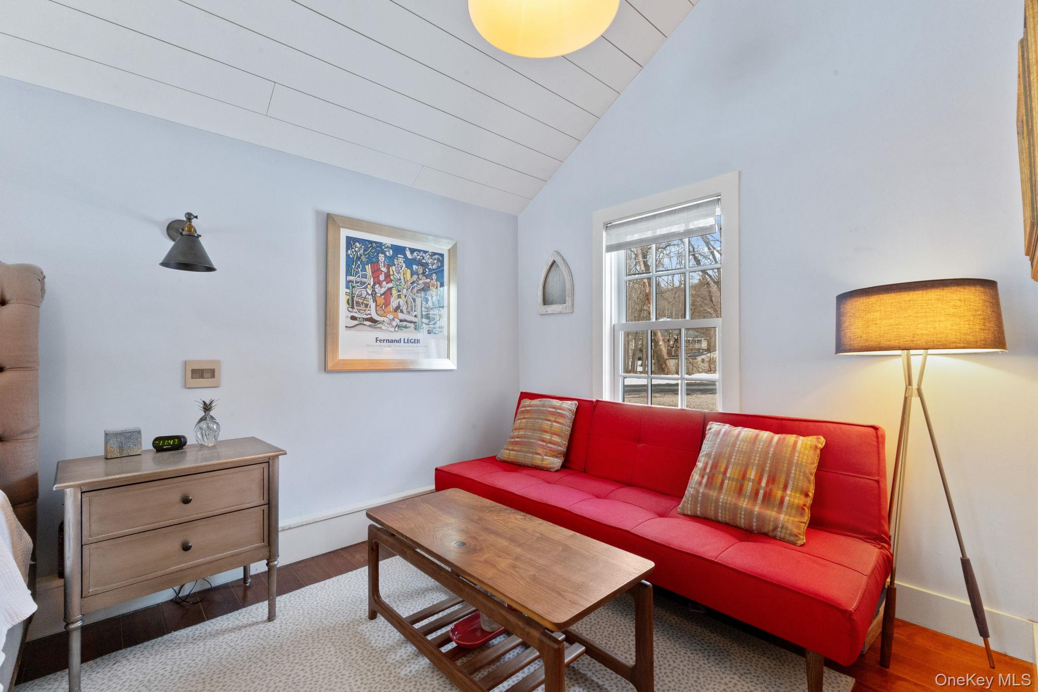 8 South Bedford Road Pound Ridge, NY 10576 - Photo 19 of 32 a living room with furniture and a lamp