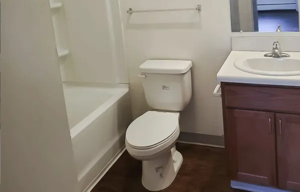 a bathroom with a toilet and a sink