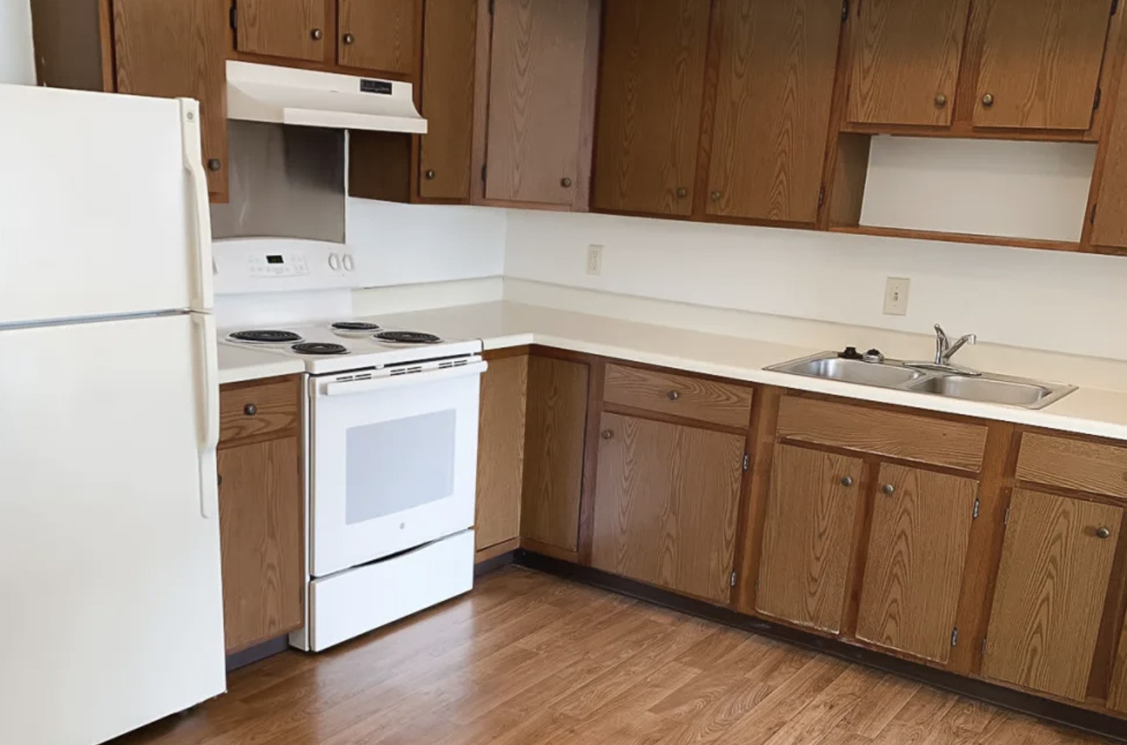 201 Country Club Batesville, IN 47006 - Photo 7 of 11 a kitchen with a sink cabinets and wooden floor