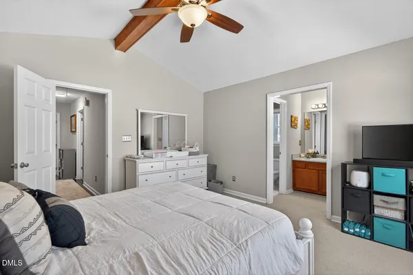 a bed room with a bed and a chandelier
