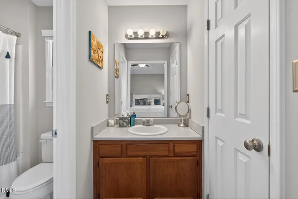 a bathroom with a sink double vanity and a mirror