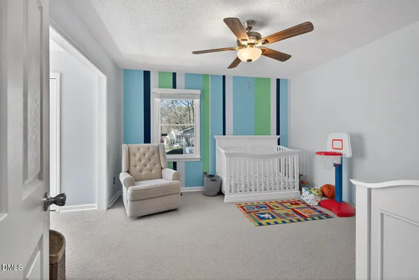 a bathroom with a sink and a mirror with toilet