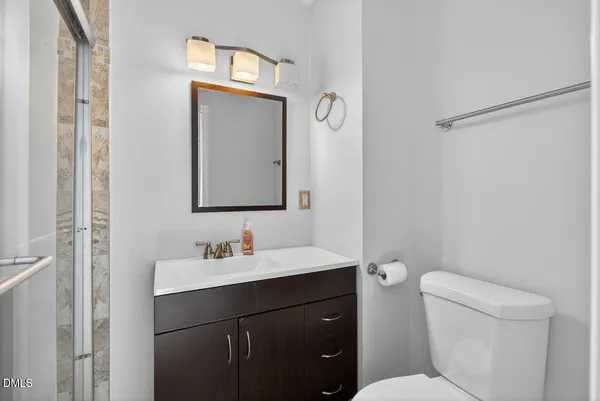 a room with a dresser and a window