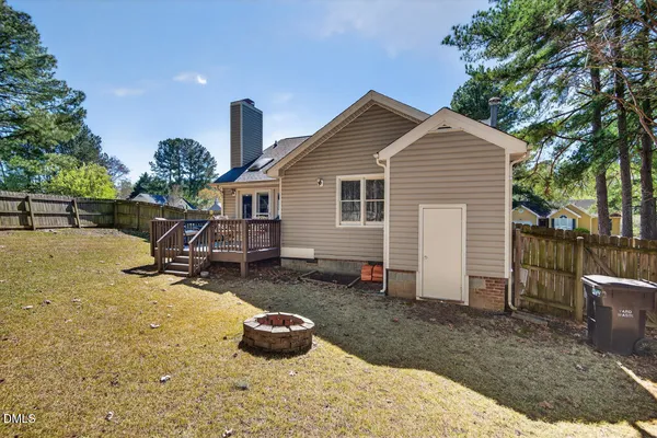 a view of a house with a bench in a patio