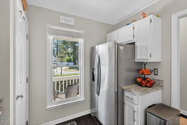 a kitchen with stainless steel appliances granite countertop a sink and a stove