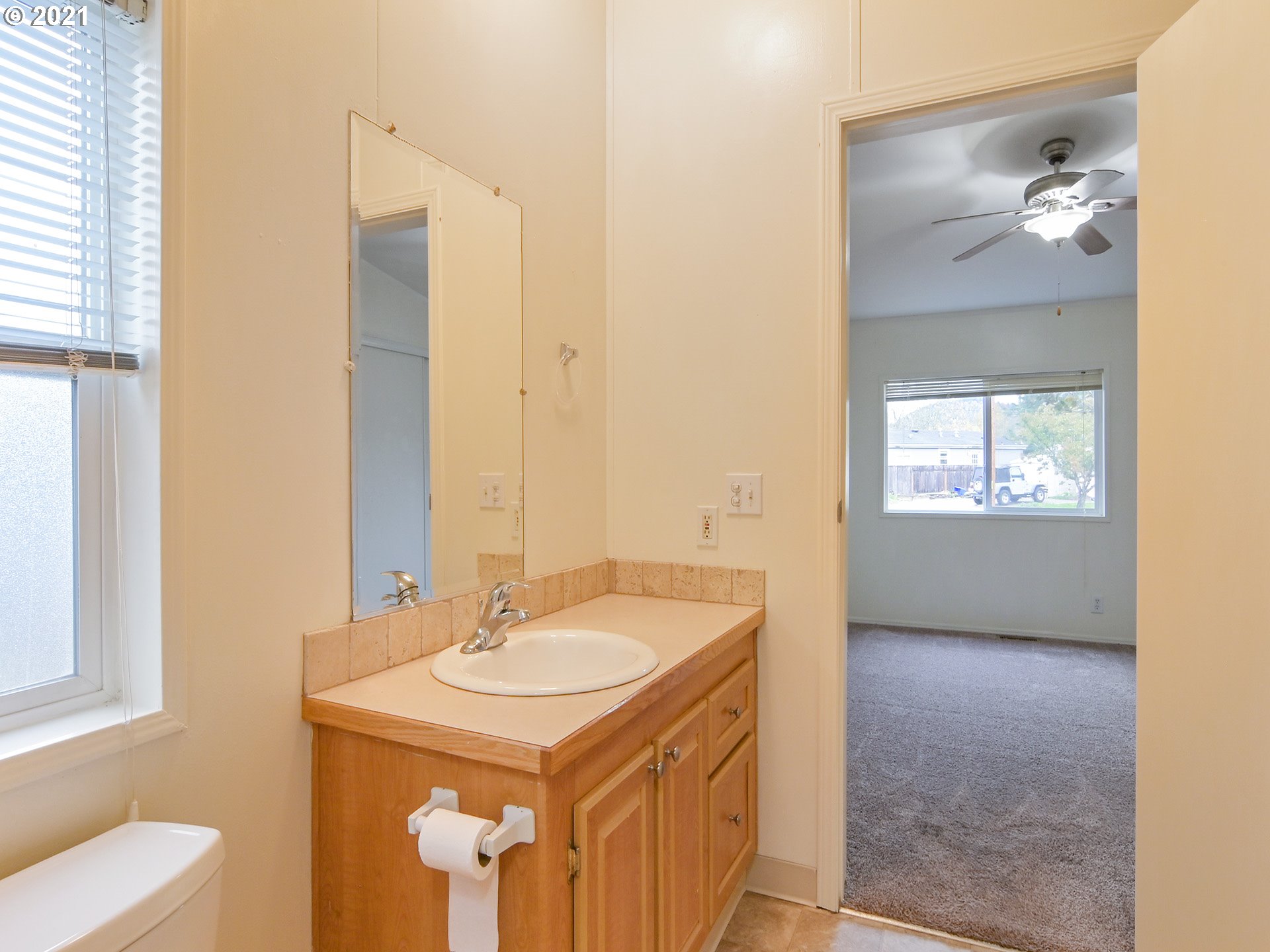 469 48th Street Springfield, OR 97478 - Photo 24 of 32 a bathroom with a sink and a mirror