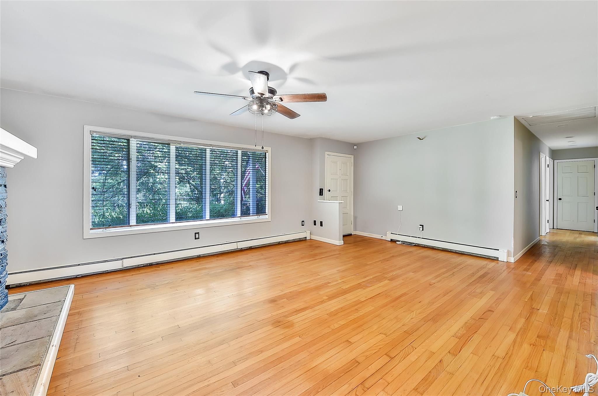 18 Stage Road Pine Island, NY 10969 - Photo 15 of 42 a view of an empty room with wooden floor and a window