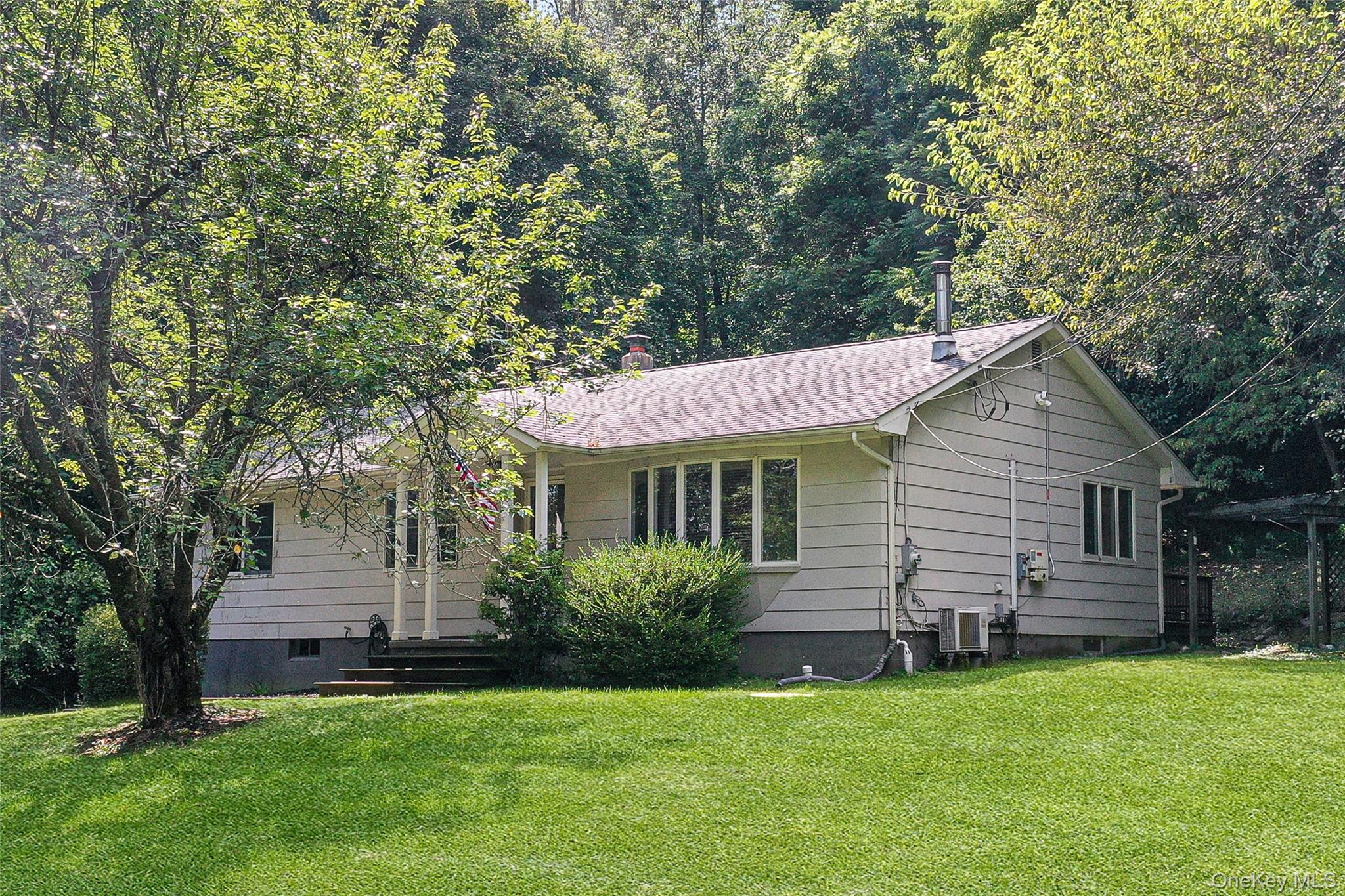 18 Stage Road Pine Island, NY 10969 - Photo 2 of 42 a backyard of a house with table and chairs