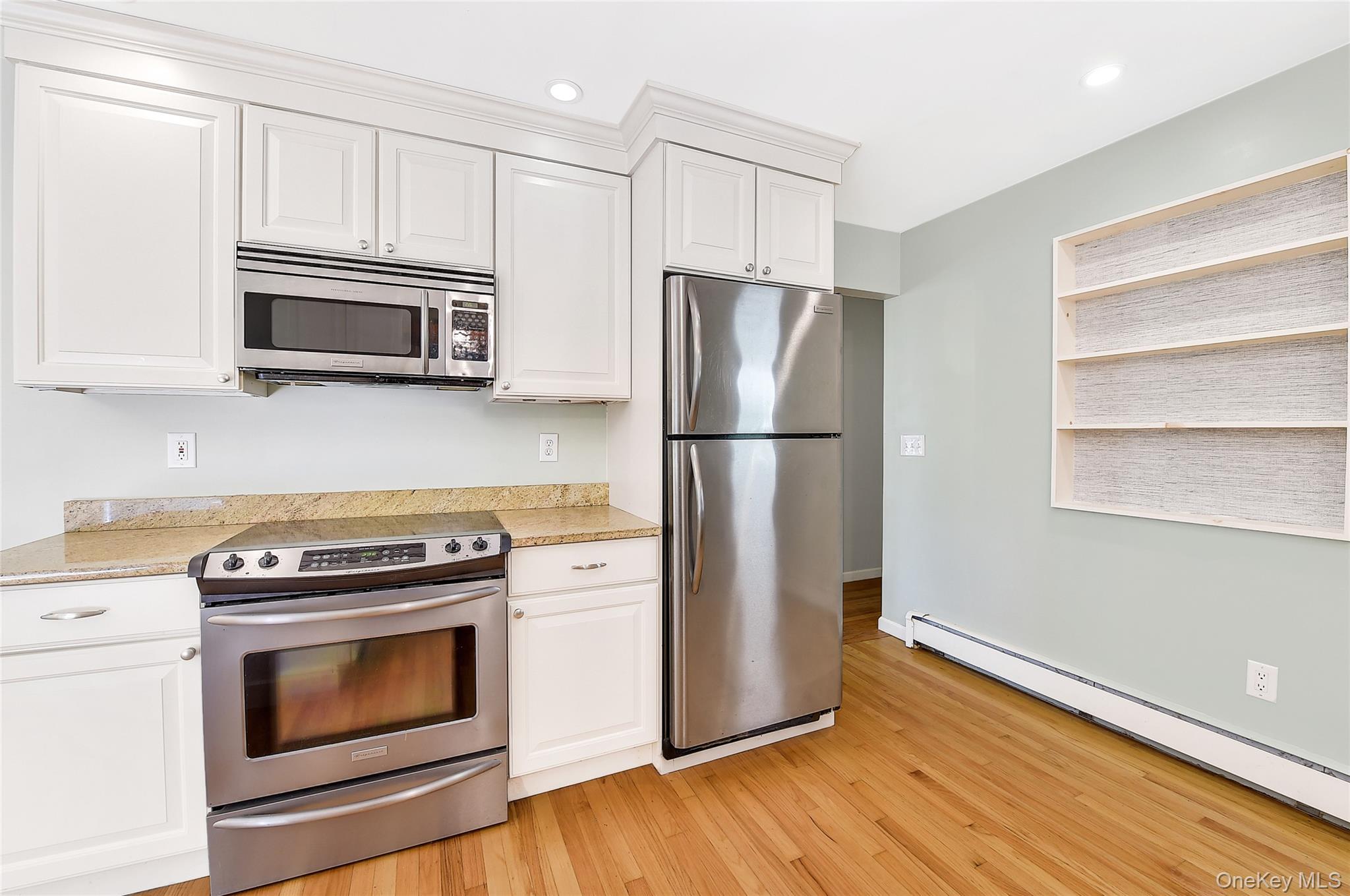 18 Stage Road Pine Island, NY 10969 - Photo 21 of 42 a kitchen with cabinets stainless steel appliances and wooden floor