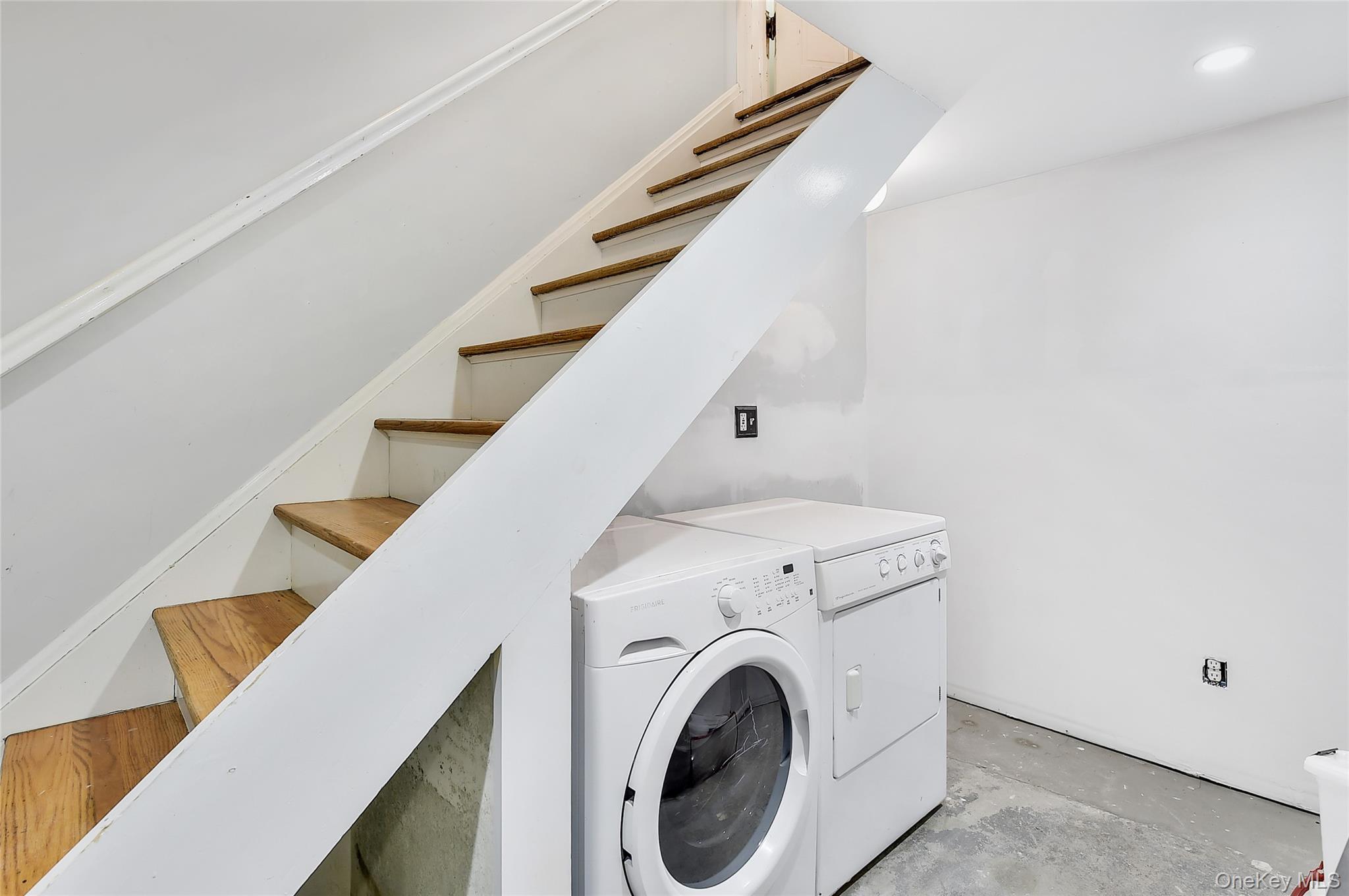18 Stage Road Pine Island, NY 10969 - Photo 32 of 42 a view of washer and dryer with kitchen in the background
