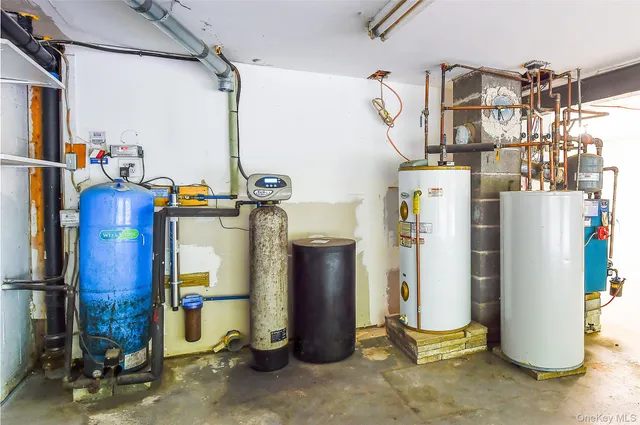 a view of storage and utility room with refrigerator and storage
