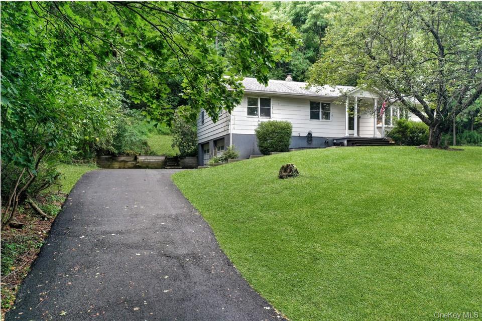 18 Stage Road Pine Island, NY 10969 - Photo 4 of 42 a front view of a house with a yard and trees
