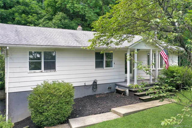 a view of a house with garden and plants