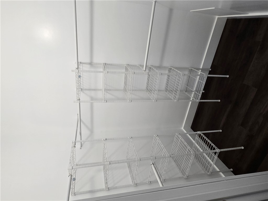 28 Ames Street Seneca, SC 29678 - Photo 6 of 22 Functional wire shelving maximizes organization within this practical walk-in closet space.