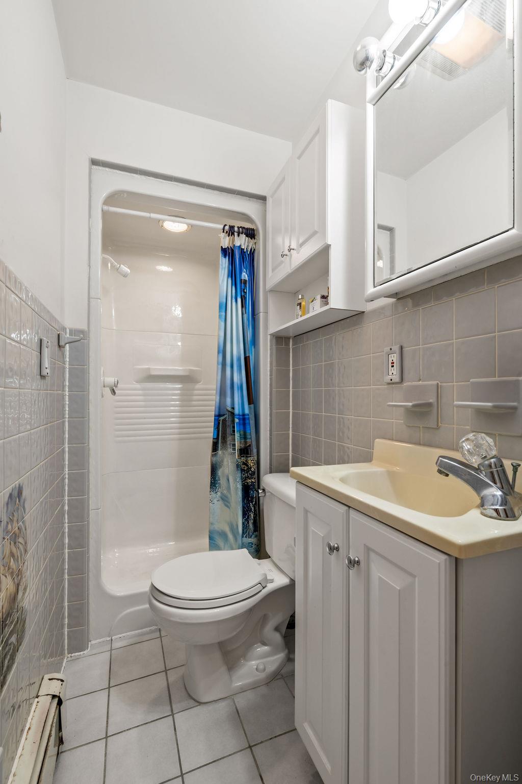 289 Seven Springs Mountain Road Monroe, NY 10950 - Photo 19 of 25 a bathroom with a sink toilet and shower