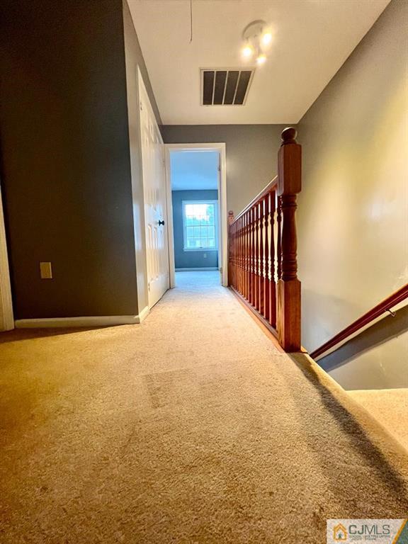 839 Valley Street, Unit C Vauxhall, NJ 07088 - Photo 8 of 10 a view of an empty room with stairs