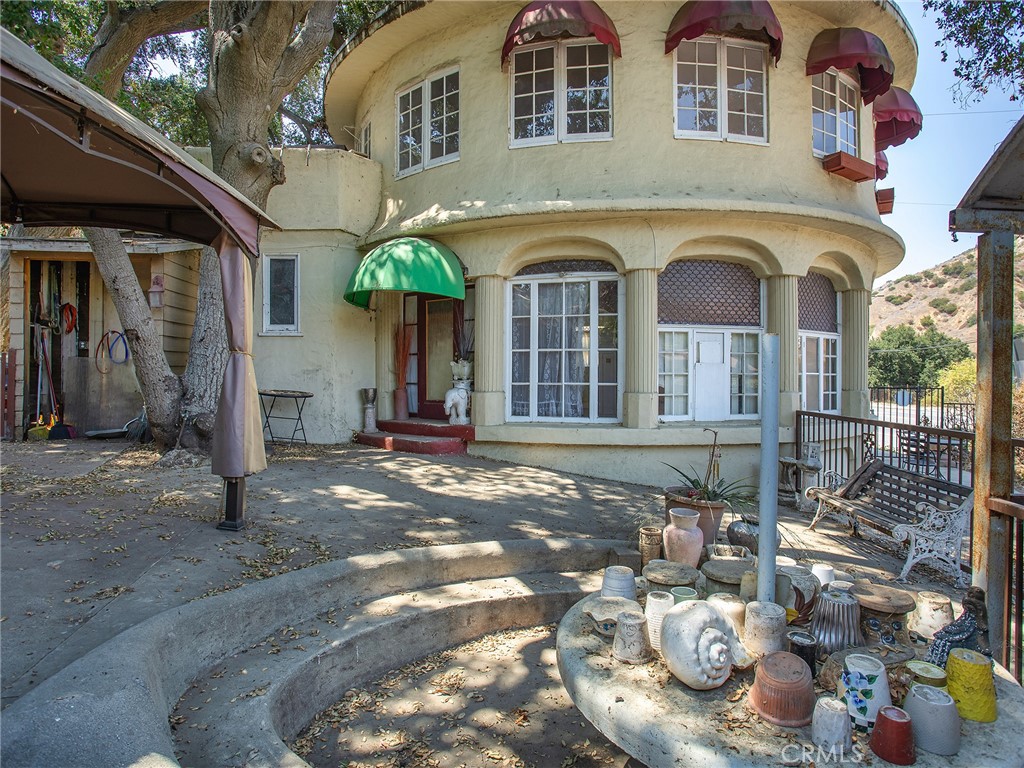 8618 La Tuna Canyon Road Sun Valley, CA 91352 - Photo 22 of 50 a view of a brick house with potted plants