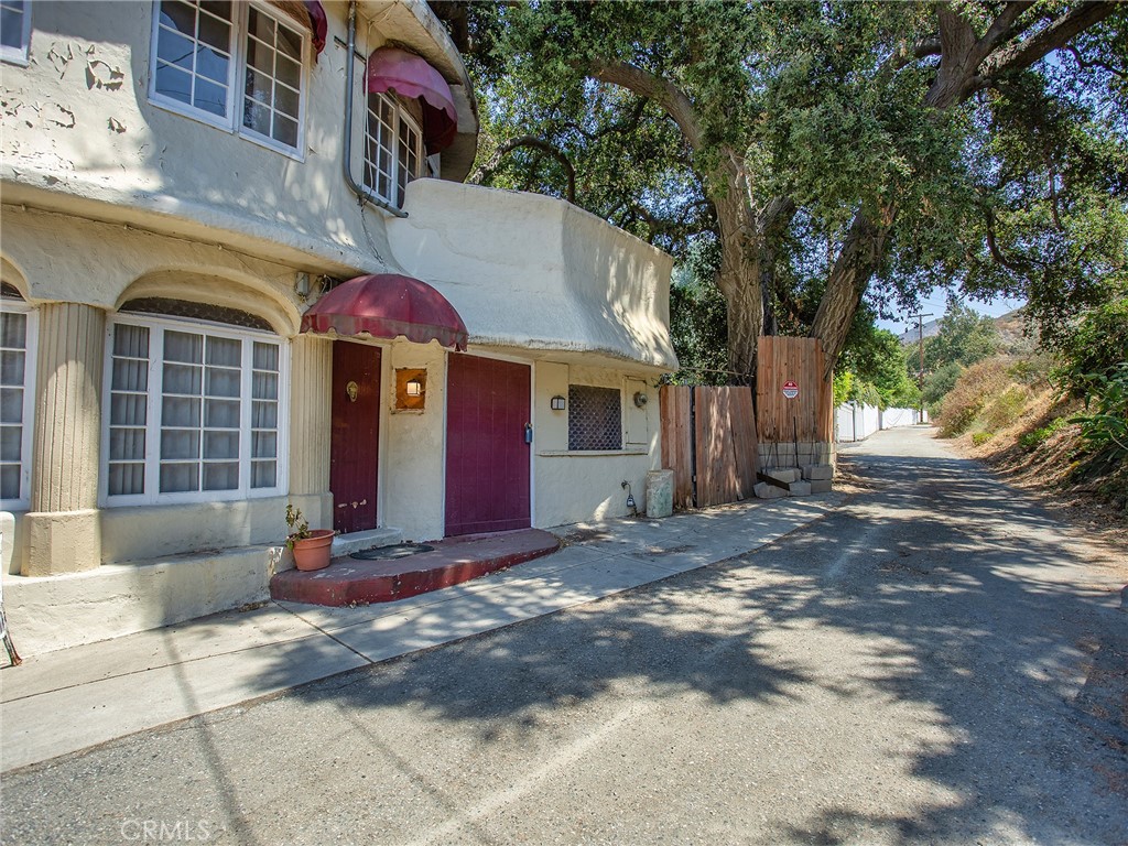8618 La Tuna Canyon Road Sun Valley, CA 91352 - Photo 3 of 50 a view of a white house with a large tree