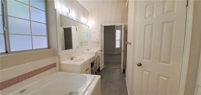 a bathroom with a sink a bath tub and a shower