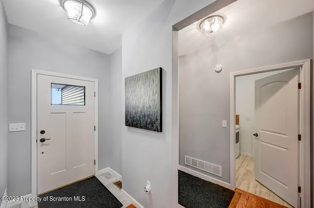 a living room with fireplace furniture and a flat screen tv