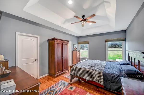 a bed room with a bed and a chandelier