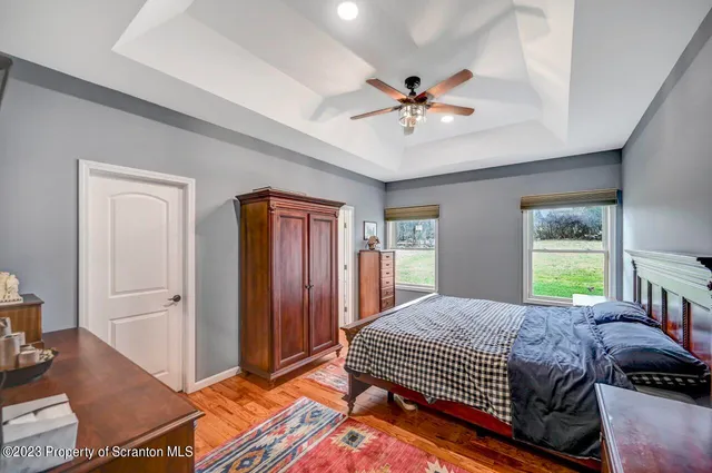 a bed room with a bed and a chandelier