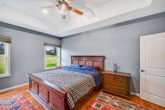 a bedroom with a bed and a dresser in it