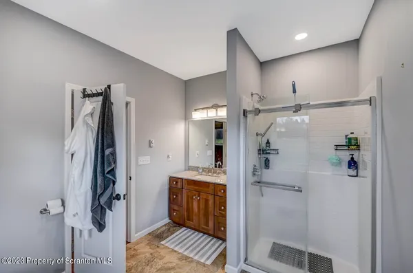 a bathroom with a sink double vanity and a mirror