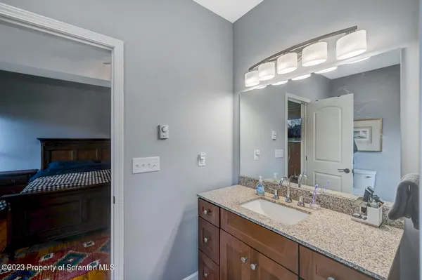 a bedroom with a large bed and a large window