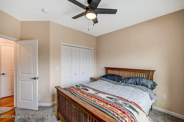 a bathroom with a granite countertop sink toilet a shower curtain and a bath tub