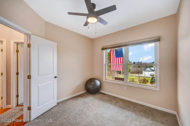 a picture of a room with a white wall and a picture