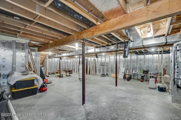 a front view of house with yard and trees