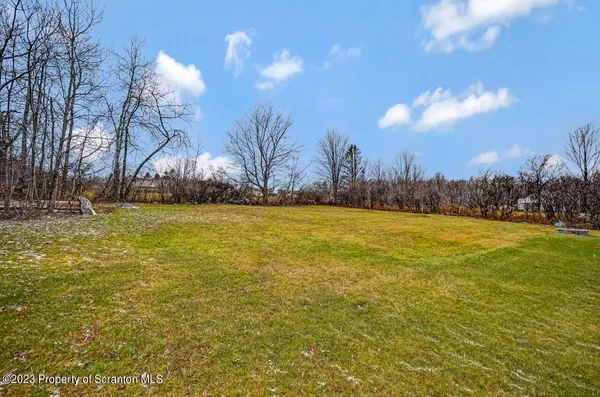 a view of a house with swimming pool and sitting area