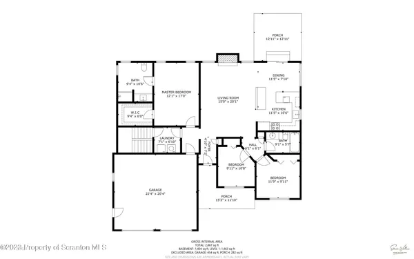 a backyard of a house with outdoor seating