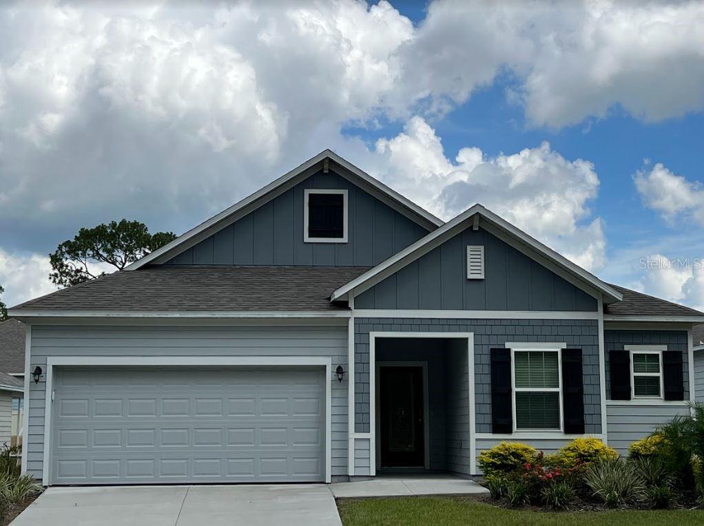 24470 Northwest 6th Road Newberry, FL 32669 - Photo 1 of 22 a front view of a house with a yard