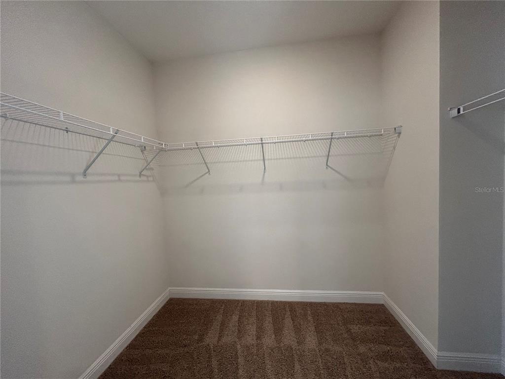 24470 Northwest 6th Road Newberry, FL 32669 - Photo 15 of 22 a view of a room with racks on the wall