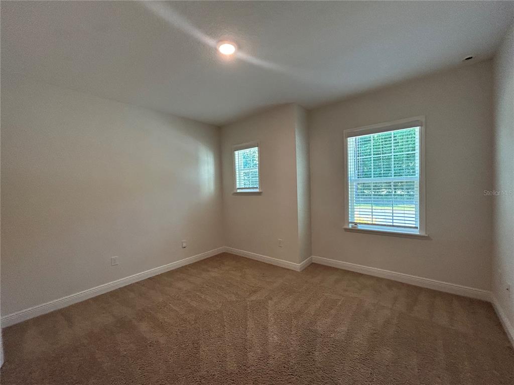 24470 Northwest 6th Road Newberry, FL 32669 - Photo 19 of 22 an empty room with windows