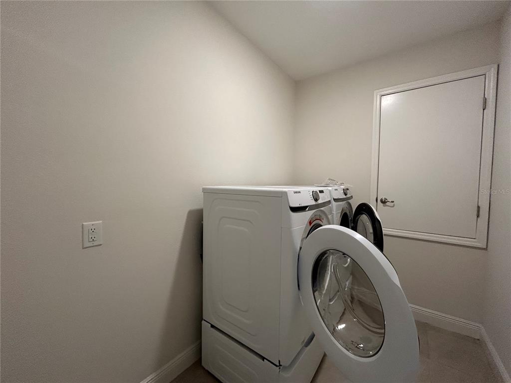 24470 Northwest 6th Road Newberry, FL 32669 - Photo 21 of 22 a utility room with dryer and washer