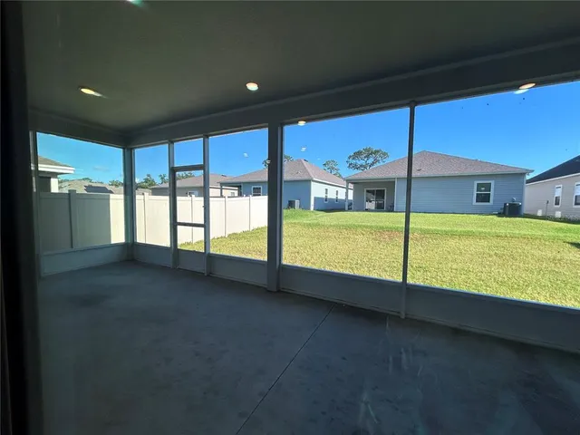 a view of an empty room with a large window
