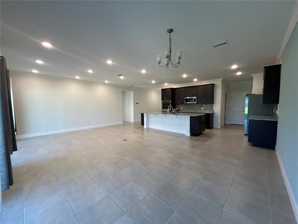 24470 Northwest 6th Road Newberry, FL 32669 - Photo 3 of 22 a view of kitchen with a sink and a stove top oven