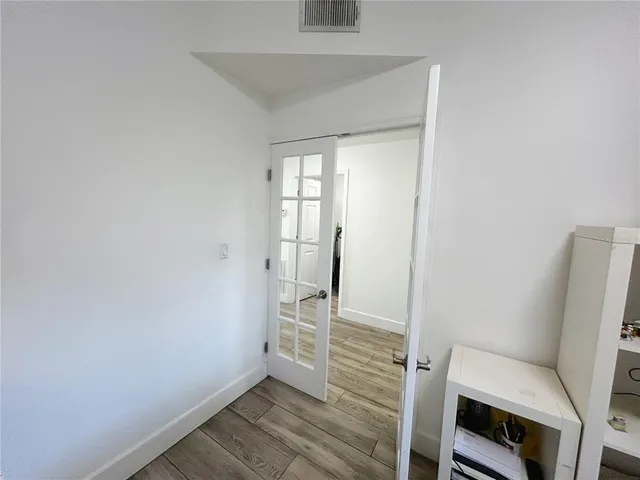 a utility room with cabinets washer and dryer
