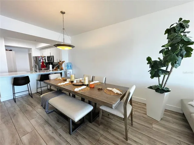 a living room with furniture a rug and a large window