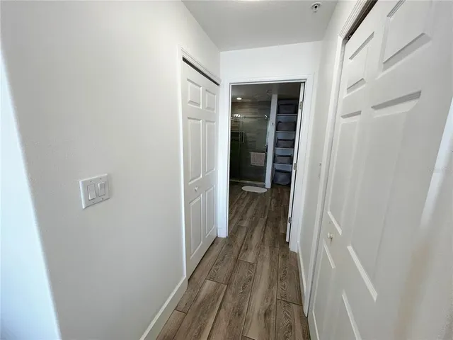 a bathroom with a double vanity sink toilet and shower