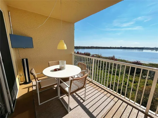 a view of balcony with wooden floor