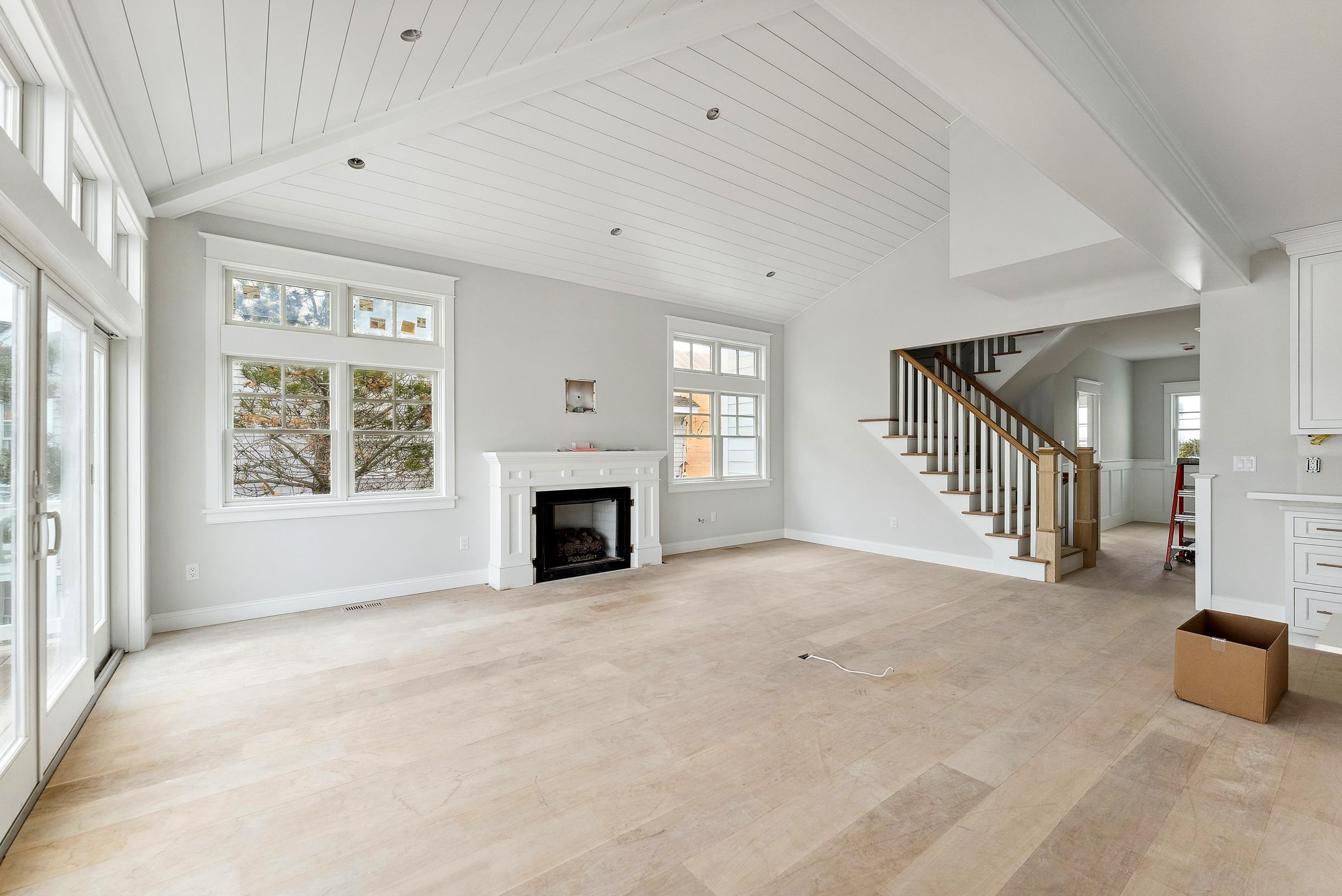 225 7th Street Avalon, NJ 08202 - Photo 6 of 37 a view of an empty room with a fireplace and a window