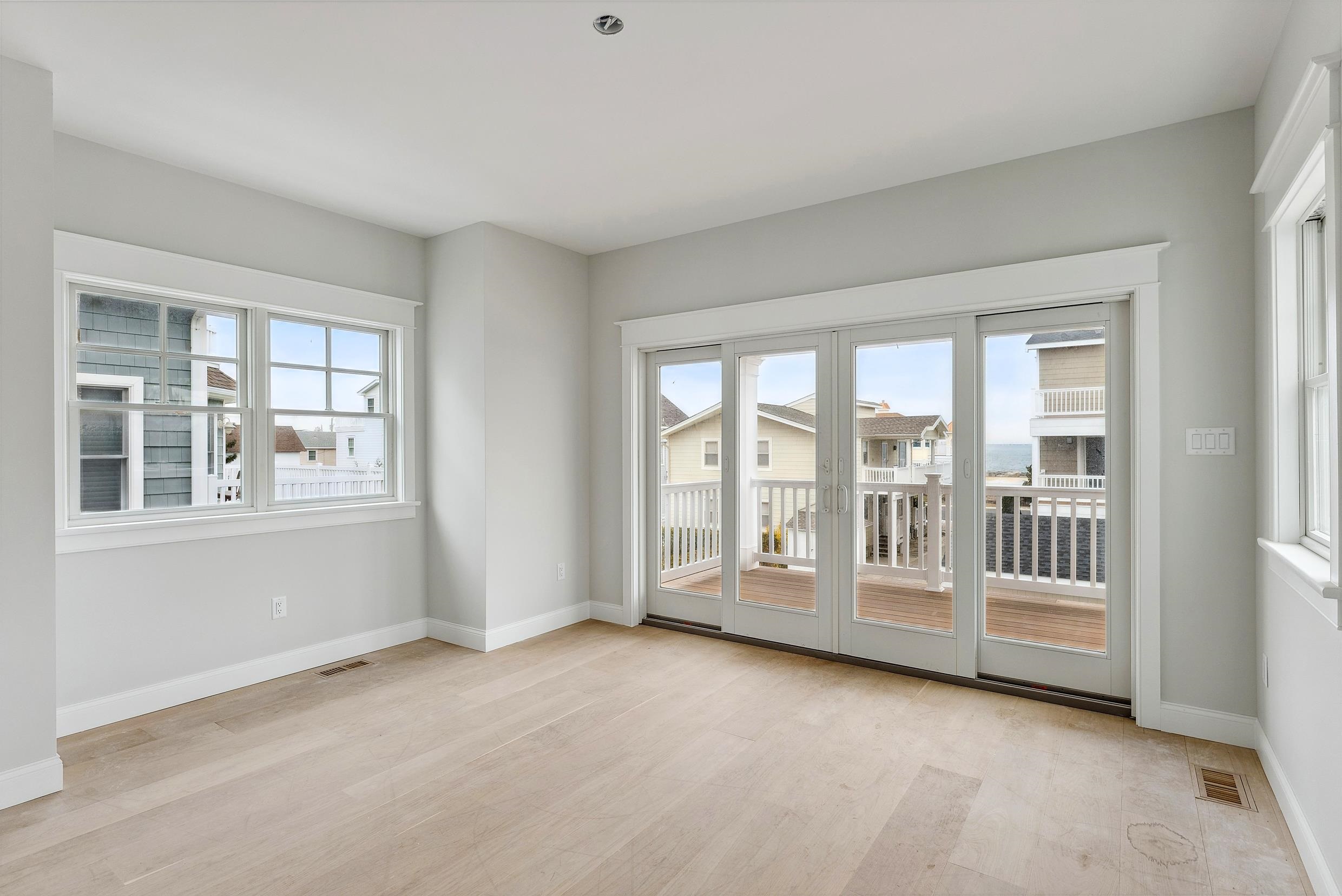 225 7th Street Avalon, NJ 08202 - Photo 7 of 37 a view of an empty room with a window