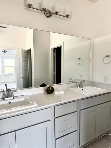 a bathroom with a glass door shower and toilet